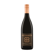 A bottle of organic Birgit Braunstein Blaufränkisch Heide Burgenland red wine. The bottle is dark glass with a copper-colored screw cap and a brown label featuring a stylized